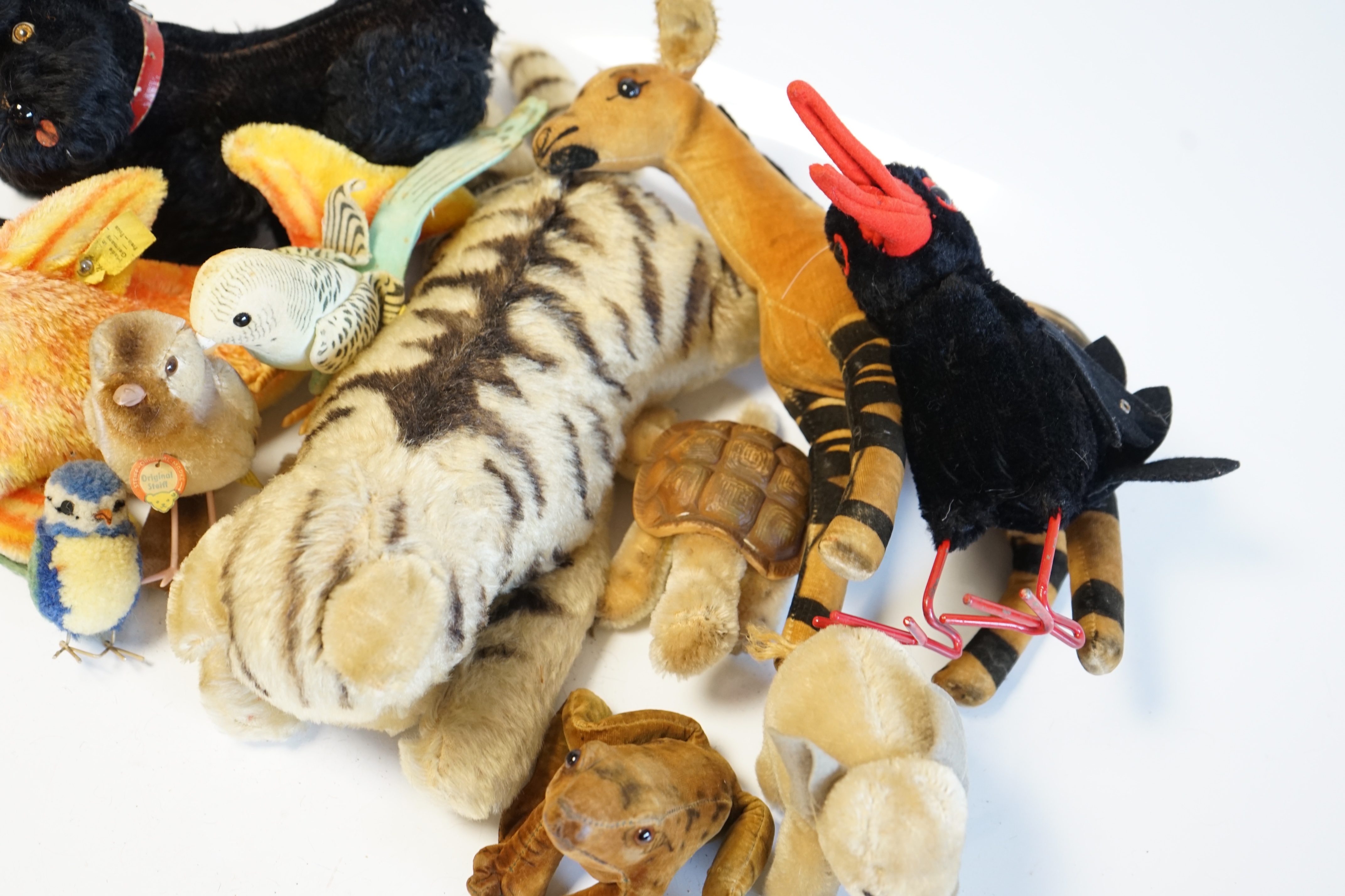 Eleven assorted 1960's Steiff toys, including Knobby the poodle, a large goldfish and various birds. Condition - fair